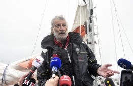 French skipper Jean-Luc van den Heede (C), 73 years old, talks to the press in Les Sables D' Olonne after winning the Golden Globe race on January 29, 2019. - The Golden Globe Race is an around the world race, without stopover, without assistance, without electronic nor GPS. (Photo by SEBASTIEN SALOM GOMIS / AFP)