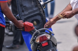 A motorcycle being refuelled at a Fuel Supply Maldives (FSM) shed operated by STO. PHOTO: HUSSAIN WAHEED / MIHAARU