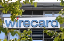 (FILES) In this file photo taken on September 18, 2018 Picture taken on September 18, 2018 shows the company logo at the headquarters of German payment processing firm Wirecard in Aschheim near Munich, southern Germany. - Shares in German payment processing firm Wirecard plunged for the second time in a week on February 1, 2019, after a newspaper report reinforced allegations of fraud in its Asian operations. (Photo by Christof STACHE / AFP)