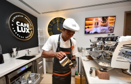 A staff at CAFE LUX* prepares a coffee, at LUX* North Male' Atoll. PHOTO: HUSSAIN WAHEED / MIHAARU