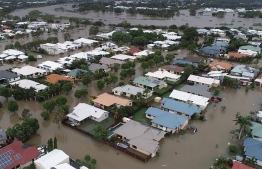 A handout photo taken and recieved February 4, 2019, from the Queensland Fire and Emergency Services (QFES) shows the flooding in Townsville. - Australia's military has been deployed to tackle devastating "once-in-a-century" floods that have inundated homes, schools and airports in the country's northeast, forcing hundreds to flee and bringing crocodiles onto the streets. (Photo by Queensland Fire and Emergency Services / QUEENSLAND FIRE AND EMERGENCY SERVICES / AFP) / ----EDITORS NOTE ----RESTRICTED TO EDITORIAL USE MANDATORY CREDIT " AFP PHOTO /QUEENSLAND FIRE AND EMERGENCY SERVICES" NO MARKETING NO ADVERTISING CAMPAIGNS - DISTRIBUTED AS A SERVICE TO CLIENTS