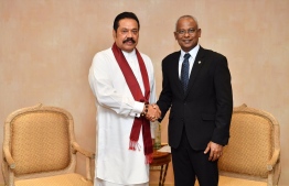 Former President of Sri Lanka and current opposition leader, Mahinda Rajapaksa (L), shakes hands with President Ibrahim Mohamed Solih on February 5, 2019. PHOTO/PRESIDENT'S OFFICE