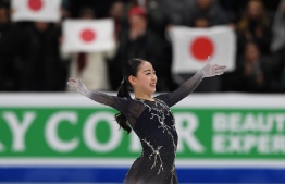 Rika Kihira of Japan celebrates after winning the Womens competition during the ISU Four Continents Figure Skating Championship at the Honda Center in Anaheim, California on February 8, 2019. (Photo by Mark RALSTON / AFP)