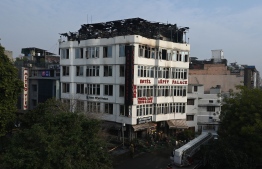 A general view shows the Hotel Arpit Palace after a fire broke out on its premises in New Delhi on February 12, 2019. - At least 17 people died on February 12 as a fire tore through the budget hotel in Delhi before dawn, in the latest disaster to raise concerns over fire safety in India. (Photo by Prakash SINGH / AFP)