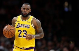 (FILES) In this file photo taken on February 06, 2019 BOSTON, MASSACHUSETTS - FEBRUARY 07: LeBron James #23 of the Los Angeles Lakers dribbles against the Boston Celtics during the second half at TD Garden 9 in Boston, Massachusetts. - LeBron James remains the top-earning player in the NBA while an increasing number of stars have boosted their income through off-field activities, a Forbes survey revealed February 12, 2019. Forbes said that Los Angeles Lakers star James was the highest-paid player in basketball for a fifth straight year, pocketing an estimated $88.7 million in 2018-2019. (Photo by Maddie Meyer / GETTY IMAGES NORTH AMERICA / AFP)