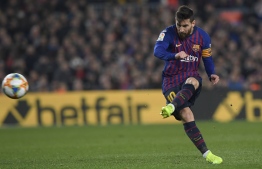 Barcelona's Argentinian forward Lionel Messi kicks the ball during the Spanish Copa del Rey (King's Cup) semi-final first leg football match between FC Barcelona and Real Madrid CF at the Camp Nou stadium in Barcelona on February 6, 2019. (Photo by LLUIS GENE / AFP)
