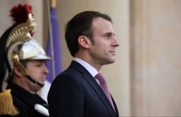 French President Emmanuel Macron waits for the arrival of the Ivorian President for a meeting at the Elysee Palace in Paris on Febuary 15, 2019. (Photo by LUDOVIC MARIN / AFP)