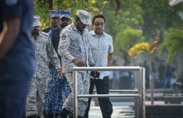 Former President Abdulla Yameen escorted back to prison after the Criminal Court hearing. PHOTO/MIHAARU