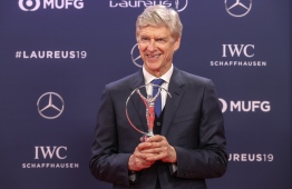 Winner of the Laureus Lifetime Achievement award, former Arsenal football team manager Arsene Wenger poses after receiving his award during the 2019 Laureus World Sports Awards ceremony at the Sporting Monte-Carlo complex in Monaco on February 18, 2019. (Photo by Valery HACHE / AFP)