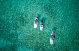 Aerial view of Dr Claire Petros, Dhafeena Hassan Ibrahim and Shaziya Saeed of the Stand Up for Our Seas team, on their paddleboards. PHOTO/STAND UP FOR OUR SEAS