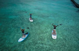 Dr Claire Petros, Dhafeena Hassan Ibrahim and Shaziya Saeed of the Stand Up for Our Seas team, on their paddleboards. PHOTO/STAND UP FOR OUR SEAS