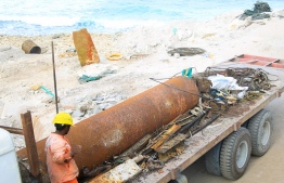 A large amount of marine debris and a 10-foot pillar removed from Raalhugandu. PHOTO: ALI AHSAN/COOKIE PICTURE
