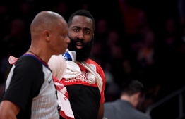 (FILES) In this file photo taken on February 20, 2019, James Harden #13 of the Houston Rockets argues with referee Michael Smith #38 after getting three fouls during the first quarter in a 111-106 loss to the Los Angeles Lakers at Staples Center on February 21, 2019 in Los Angeles, California. - Houston Rockets guard James Harden was fined $25,000 by the NBA on February 23, 2019, for public criticism of officiating, the league announced. Harden made his comments to reporters after the Los Angeles Lakers defeated the visiting Rockets 111-106 on Thursday at Staples Center. Referee Scott Foster aroused Harden's anger, the versatile All-Star saying Foster has a "personal" issue with the Rockets and should not be permitted to officiate any more of their games. (Photo by Harry How / GETTY IMAGES NORTH AMERICA / AFP)
