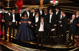 Producers of Best Picture nominee "Green Book" Peter Farrelly and Nick Vallelonga accepts the award for Best Picture with the whole crew on stage during the 91st Annual Academy Awards at the Dolby Theatre in Hollywood, California on February 24, 2019. (Photo by VALERIE MACON / AFP)