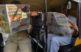 Auto-rickshaw drivers read newspapers, with front page reports on the Indian air strikes against militant camps in Pakistan's territory, in Mumbai on February 27, 2019. - India wants to avoid any "further escalation of the situation" after conducting "pre-emptive" air strikes against militant camps in Pakistani territory, foreign minister Sushma Swaraj said on February 27.
The incursion across the ceasefire line that divides Kashmir came after New Delhi threatened retaliation over the February 14 suicide bombing that killed 40 Indian troops, and was claimed by the Pakistan-based Jaish-e-Mohammad (JeM) group. (Photo by Indranil MUKHERJEE / AFP)