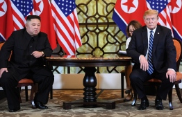US President Donald Trump (R) and North Korea's leader Kim Jong Un hold a meeting during the second US-North Korea summit at the Sofitel Legend Metropole hotel in Hanoi on February 28, 2019. (Photo by Saul LOEB / AFP)