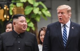 US President Donald Trump (R) walks with North Korea's leader Kim Jong Un during a break in talks at the second US-North Korea summit at the Sofitel Legend Metropole hotel in Hanoi on February 28, 2019. (Photo by Saul LOEB / AFP)
