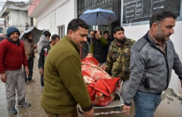 An injured man is carried on a stretcher at a hospital in the Indian Kashmir frontier town of Mendhar on March 2, 2019, after being wounded in his home when it was struck by a mortar shell that his family said was fired by Pakistan troops along the Line of Control (LoC) that divides Kashmir between India and Pakistan. - A video of an Indian pilot freed from Pakistani custody in which he praises Pakistan's army March 2 sparked anger in India and concern that it was recorded under duress. Violence meanwhile continued to rage in Kashmir, with both sides firing mortars and artillery over the Line of Control (LoC) frontier, killing four civilians on the Indian side and one in Pakistan-administered Kashmir. (Photo by SAJJAD HUSSAIN / AFP)