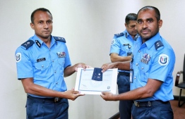 Newly appointed Assistant Commissioner of Police Mohamed Riyaz being presented the letter of appointment. PHOTO: MALDIVES POLICE SERVICE