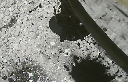 This handout photograph received from the Hayabusa2 spacecraft and made available by the Japan Aerospace Exploration Agency (JAXA) on March 6, 2019 shows stone and sand after bullets were fired into the surface to collect data by the Hayabusa2 spacecraft after landing on the asteroid Ryugu. - Hayabusa2, the Japanese probe sent to examine an asteroid 300 million kilometres from the Earth for clues about the origin of life and the solar system, landed successfully on February 22, scientists said. (Photo by JAXA / JAXA / AFP) / --- RESTRICTED TO EDITORIAL USE - MANDATORY CREDIT "AFP PHOTO / JAXA" - NO MARKETING NO ADVERTISING CAMPAIGNS - DISTRIBUTED AS A SERVICE TO CLIENTS ---
