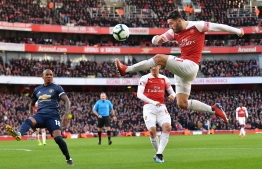 Arsenal's German-born Bosnian defender Sead Kolasinac (R) plays the ball during the English Premier League football match between Arsenal and Manchester United at the Emirates Stadium in London on March 10, 2019. (Photo by Ben STANSALL / AFP) / RESTRICTED TO EDITORIAL USE. No use with unauthorized audio, video, data, fixture lists, club/league logos or 'live' services. Online in-match use limited to 120 images. An additional 40 images may be used in extra time. No video emulation. Social media in-match use limited to 120 images. An additional 40 images may be used in extra time. No use in betting publications, games or single club/league/player publications. / 