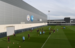 Manchester City players team attend a team training session at City Football Academy in Manchester, north west England on March 11, 2019 on the eve of their Champions League round of 16, second leg football match against FC Schalke. (Photo by Paul ELLIS / AFP)