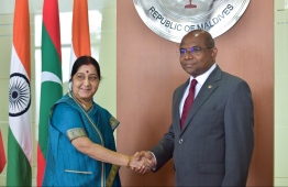 Foreign Minister Abdulla Shahid (L) greets India's Minister of External Affairs Sushma Swaraj on her official visit to Maldives on March 17, 2019. PHOTO: HUSSAIN WAHEED/MIHAARU