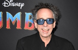 In this file photo taken on March 11, 2019 US director Tim Burton arrives for the world premiere of Disney's "Dumbo" at El Capitan theatre in Hollywood. He has never liked the Big Top, mainly due to the caged animals and freaky clowns, but for legendary director Tim Burton there is no denying the romance of running away to join the circus. PHOTO/AFP