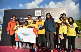 A photograph taken at the ceremony held to mark the donation made by Dhiraagu to Beautiful Eyes Down Syndrome Association. PHOTO: DHIRAAGU