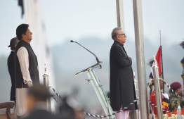 Pakistani Prime Minister Imran Khan (L) and President Arif Alvi (R) stand silent during the national anthem during the Pakistan Day parade in Islamabad on March 23, 2019. - Pakistan National Day commemorates the passing of the Lahore Resolution, when a separate nation for the Muslims of The British Indian Empire was demanded on March 23, 1940. (Photo by FAROOQ NAEEM / AFP)