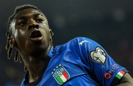 Italy's forward Moise Kean celebrates after scoring during the Euro 2020 Group J qualifying football match between Italy and Finland on March 23, 2019 at the Friuli stadium in Udine. (Photo by Andreas SOLARO / AFP)