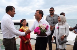 Abdul Mughunee (L) greets former President Mohamed Nasheed upon his arrival at GDh.Thinadhoo. PHOTO/MDP