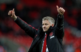 (FILES) In this file photo taken on January 13, 2019, Manchester United's Norwegian caretaker manager Ole Gunnar Solskjaer applauds the fans following the English Premier League football match between Tottenham Hotspur and Manchester United at Wembley Stadium in London. - Ole Gunnar Solskjaer has been confirmed on March 28, 2019, as full-time manager of Manchester United. (Photo by Adrian DENNIS / AFP)