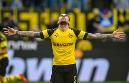 Dortmund's Spanish forward Paco Alcacer celebrates scoring 2 - 0 during the German first division Bundesliga football match Borussia Dortmund v VfL Wolfsburg on March 30, 2019 in Dortmund. (Photo by SASCHA SCHUERMANN / AFP) / RESTRICTIONS: DFL REGULATIONS PROHIBIT ANY USE OF PHOTOGRAPHS AS IMAGE SEQUENCES AND/OR QUASI-VIDEO