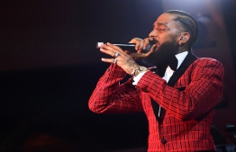 (FILES) In this file photo taken on February 07, 2019 Nipsey Hussle performs onstage at the Warner Music Pre-Grammy Party at the NoMad Hotel in Los Angeles. - Grammy-nominated rapper Nipsey Hussle was fatally shot in the US city of Los Angeles on Sunday March 31, 2019, NBC News reported, citing law enforcement sources. (Photo by Matt Winkelmeyer / GETTY IMAGES NORTH AMERICA / AFP)