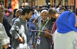 Election monitors at a polling station in the 2019 Parliamentary Election 2019. PHOTO: HUSSAIN WAHEED / MIHAARU