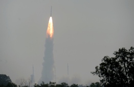 The Indian Space Research Organisation's (ISRO) Polar Satellite Launch Vehicle (PSLV-C45) launches India's Electromagnetic Spectrum Measurement satellite 'EMISAT' -- along with 28 satellites from other countries including Lithuania, Spain, Switzerland and the US -- at the Satish Dhawan Space Centre in Sriharikota, in Andhra Pradesh state, on April 1, 2019. (Photo by ARUN SANKAR / AFP)
