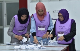 Election officials count ballot boxes after voting closes in the 2019 Parliamentary Election. PHOTO: NISHAN ALI / MIHAARU