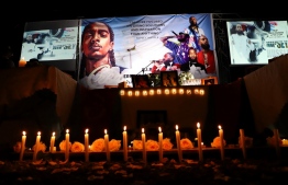 Dozens of Ethiopian and Eritrean living in Addis Ababa gather for the memorial service to honor Eritrean American rapper, Nipsey Hussle, on April 6, 2019  in Addis Ababa. - Rapper Nipsey Hussle died Sunday March 31, 2019 after a shooting in Los Angeles near a clothing store he owned. (Photo by Michael TEWELDE / AFP)
