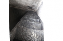 The timber stairway which caught fire. PHOTO: MALDIVES NATIONAL DEFENCE FORCE