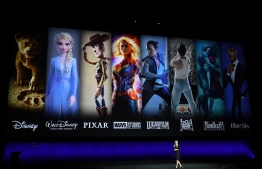 (FILES) In this file photo taken on April 03, 2019 President of Walt Disney Distribution Franchise Management, Business & Audience Insights, Cathleen Taff, speaks in front of the studios part of Walt Disney Studio on screen during the CinemaCon Walt Disney Studios Motion Pictures special presentation at the Colosseum Caesars Palace in Las Vegas, Nevada. - The battle is on. Walt Disney Co. is bringing its biggest weapons to a new streaming service, including "Star Wars" and Marvel superheroes, in what is expected to be bruising war with Netflix and others for television dominance. The media-entertainment colossus announced its Disney+ streaming service would launch in November in the United States and gradually expand internationally. (Photo by VALERIE MACON / AFP)