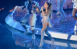 In this file photo taken on August 24, 2014 Ariana Grande  performs on stage at the MTV Video Music Awards (VMA) at The Forum in Inglewood, California. - Bubblegum pop coquette on the outside, saucy master of celebrity on the inside, there is perhaps no current star better at parlaying her own trials into larger-than-life success than Ariana Grande. (Photo by Robyn BECK / AFP)