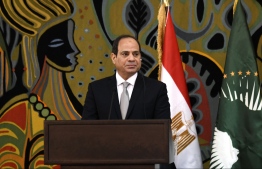 Egypt's President and current Chairperson of the African Union, Abdel Fattah al-Sisi, takes part in a joint press conference with Senegalese President at the Presidential Palace in Dakar for an official visit on April 12, 2019. (Photo by SEYLLOU / AFP)