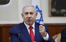 Israeli Prime Minister Benjamin Netanyahu faces a period of coalition negotiations [Ronen Zvulun/Pool via The Associated Press]