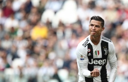 Juventus' Portuguese forward Cristiano Ronaldo gestures during the Italian Serie A football match Juventus vs Fiorentina on April 20, 2019 at the Juventus stadium in Turin. (Photo by Isabella BONOTTO / AFP)