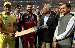 Captains of two Indian cricket teams presenting President Ibrahim Mohamed Solih with a cricket bat. PHOTO: MIHAARU FILES