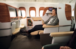A passenger reclines within an Emirates aircraft. PHOTO: EMIRATES AIRLINE