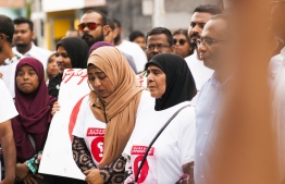 President of the Commission on Investigation of Murders and Enforced Disappearances, Husnu al-Suood (R) alongside missing journalist Ahmed Rilwan's mother and sister. PHOTO: AHMED AIHAM / THE EDITION