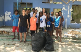 UN Resident Representative to Maldives Shoko Noda participating in a clean-up event hosed by Save The Beach. PHOTO: NODA