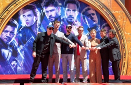(From L-R) President of Marvel Studios/Producer Kevin Feige, actors  Chris Hemsworth, Chris Evans, Robert Downey Jr., Scarlett Johansson, Mark Ruffalo and Jeremy Renner attends the Marvel Studios' 'Avengers: Endgame' cast place their hand prints in cement at TCL Chinese Theatre IMAX Forecourt on April 23, 2019, in Hollywood, California. (Photo by VALERIE MACON / AFP)